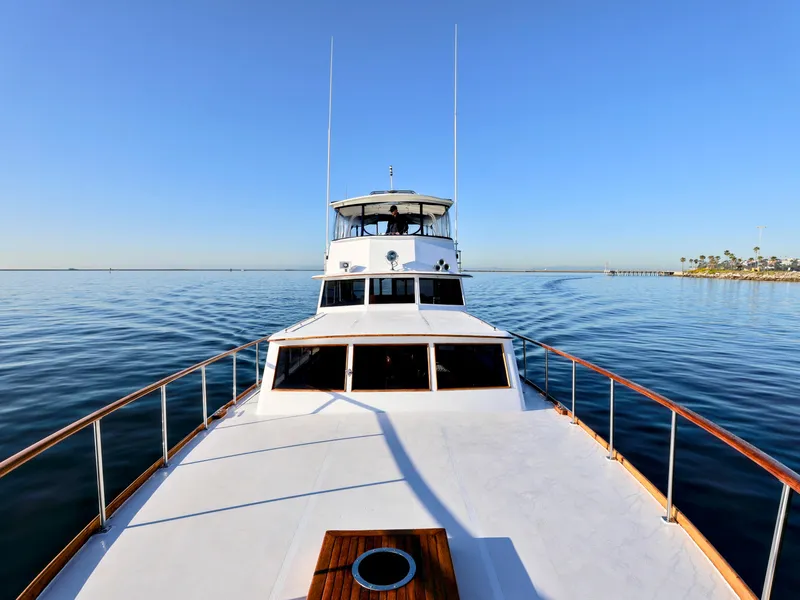 Slide: The Image of 1968 Stephens Motor Yacht cruising on calm waters under clear blue skies. - 42