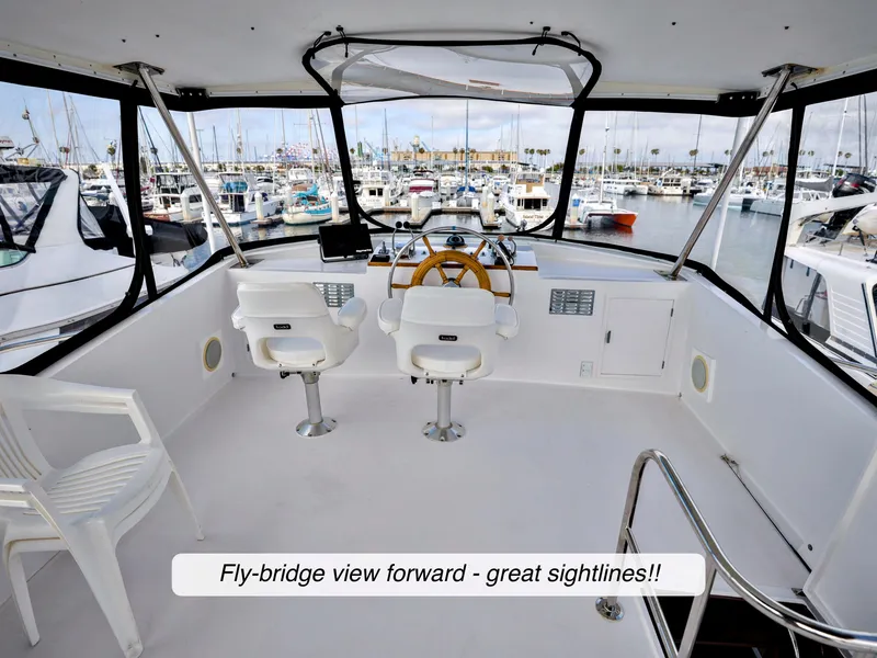 Slide: The Image of Fly-bridge of 1968 Stephens Motor Yacht with marina view and seating. - 43