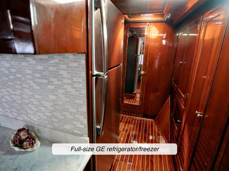 Slide: The Image of Luxurious 1968 Stephens Motor Yacht interior with full-size GE refrigerator/freezer and elegant wood finish. - 8