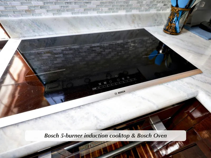 Slide: The Image of Bosch 5-burner induction cooktop on Stephens 1968 motor yacht kitchen counter. - 9