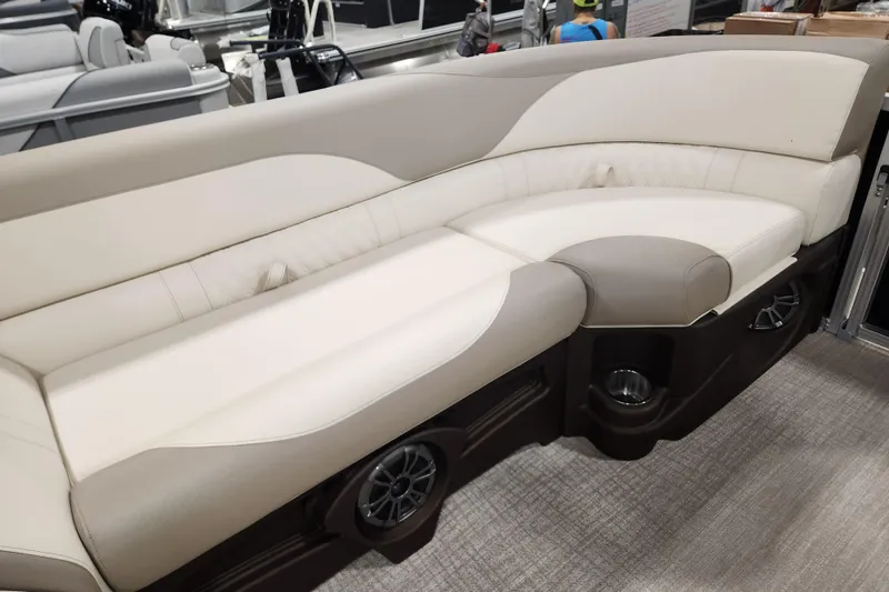 Slide: The Image of Luxurious seating on 2025 Avalon LSZ Cruise boat, featuring beige upholstery and integrated speakers. - 4