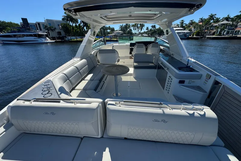 Slide: The Image of 2022 Sea Ray SLX 400 Outboard luxury boat interior with spacious seating and modern amenities. - 15