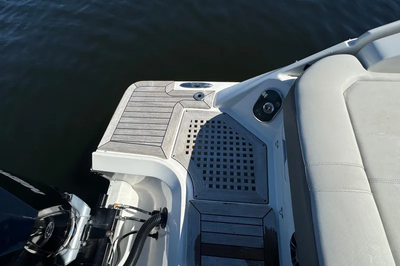 Slide: The Image of 2022 Sea Ray SLX 400 Outboard boat deck with seating and motor. - 17