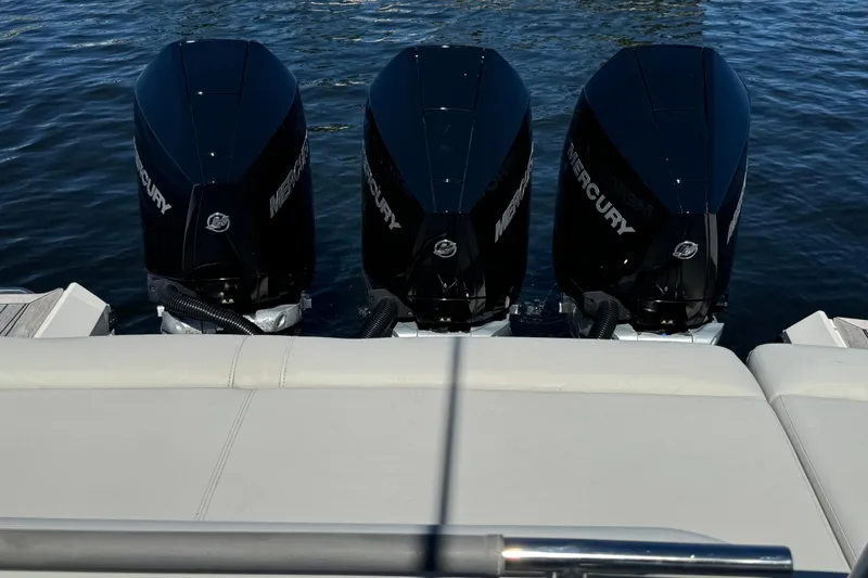 Slide: The Image of 2022 Sea Ray SLX 400 Outboard with triple Mercury engines on water. - 19