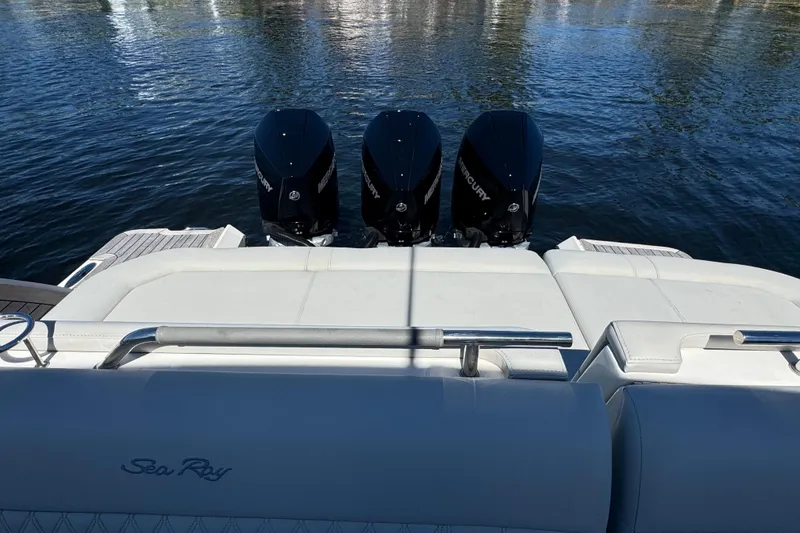 Slide: The Image of 2022 Sea Ray SLX 400 Outboard with triple Mercury engines on water. - 24