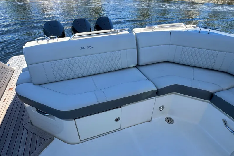 Slide: The Image of 2022 Sea Ray SLX 400 Outboard with luxurious seating on a sunny day. - 25