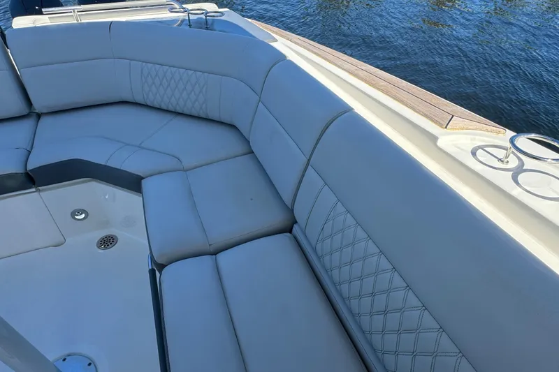Slide: The Image of Luxurious seating on 2022 Sea Ray SLX 400 Outboard boat, featuring elegant diamond stitching. - 26