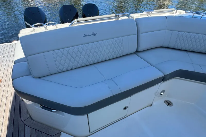 Slide: The Image of 2022 Sea Ray SLX 400 Outboard luxury seating with quilted design on a boat. - 28
