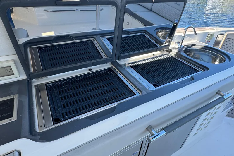 Slide: The Image of Outdoor kitchen on 2022 Sea Ray SLX 400 Outboard yacht with grill and sink. - 34