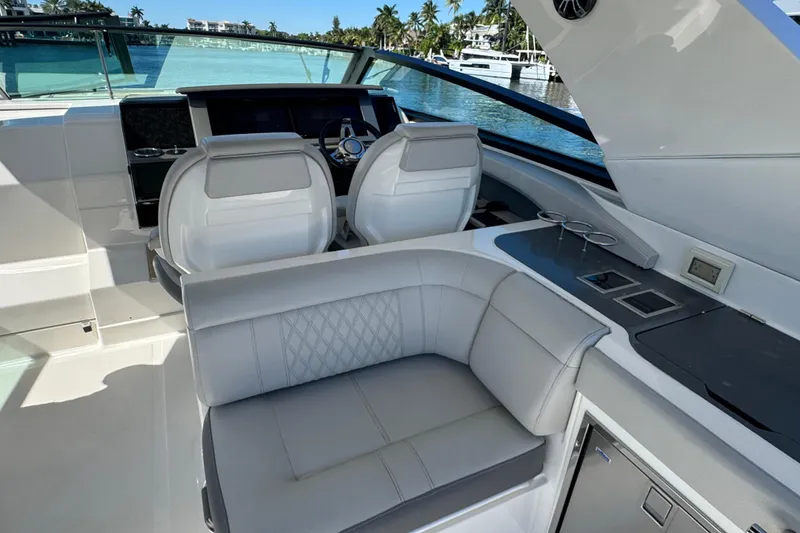 Slide: The Image of 2022 Sea Ray SLX 400 Outboard interior with luxurious seating and modern helm. - 38