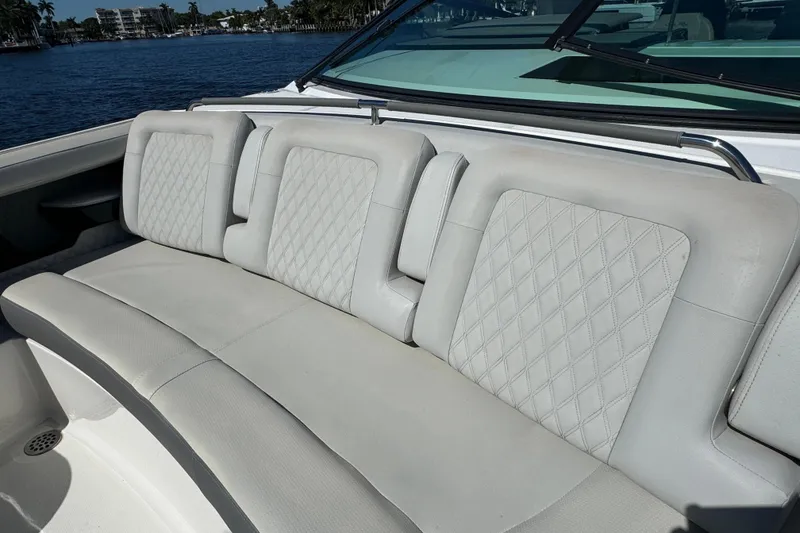 Slide: The Image of 2022 Sea Ray SLX 400 Outboard boat with luxurious white seating and diamond stitching. - 44