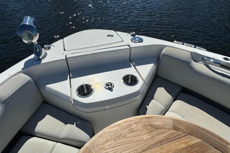 Slide: The Image of 2022 Sea Ray SLX 400 Outboard boat interior with seating and cup holders. - 46
