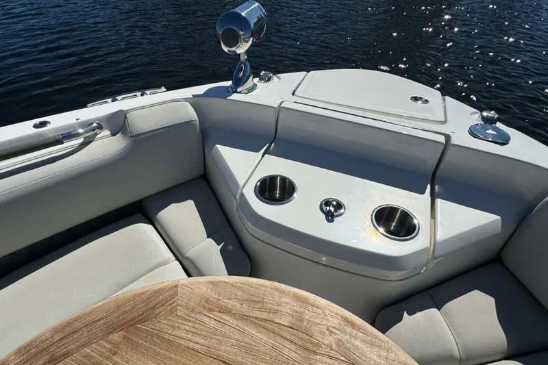 Slide: The Image of 2022 Sea Ray SLX 400 Outboard boat interior with seating and cup holders. - 47