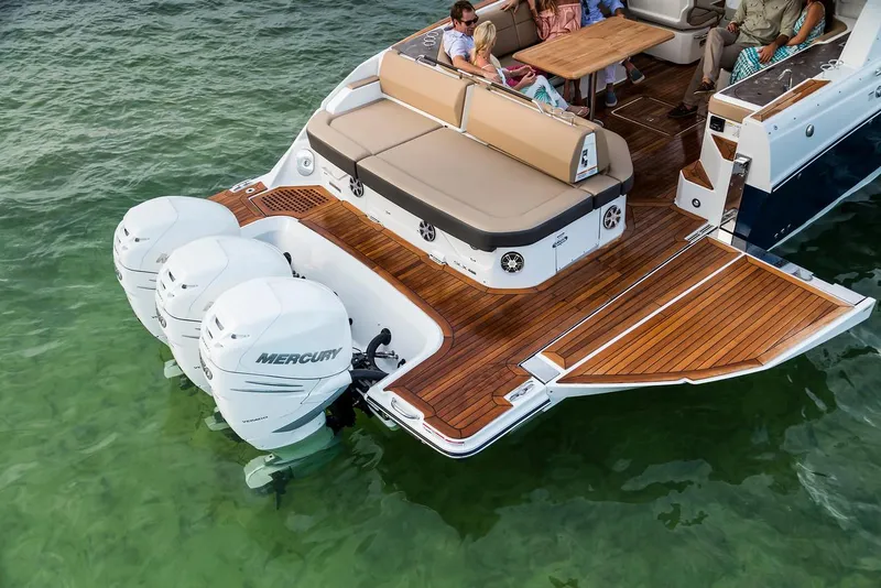 Slide: The Image of Manufacturer Provided Image: 2022 Sea Ray SLX 400 OB with triple Mercury outboard engines on the water. - 6