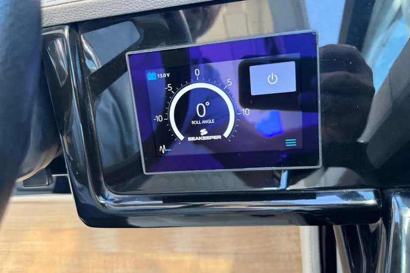 Slide: The Image of Digital display on 2022 Sea Ray SLX 400 Outboard showing Seakeeper roll angle. - 61