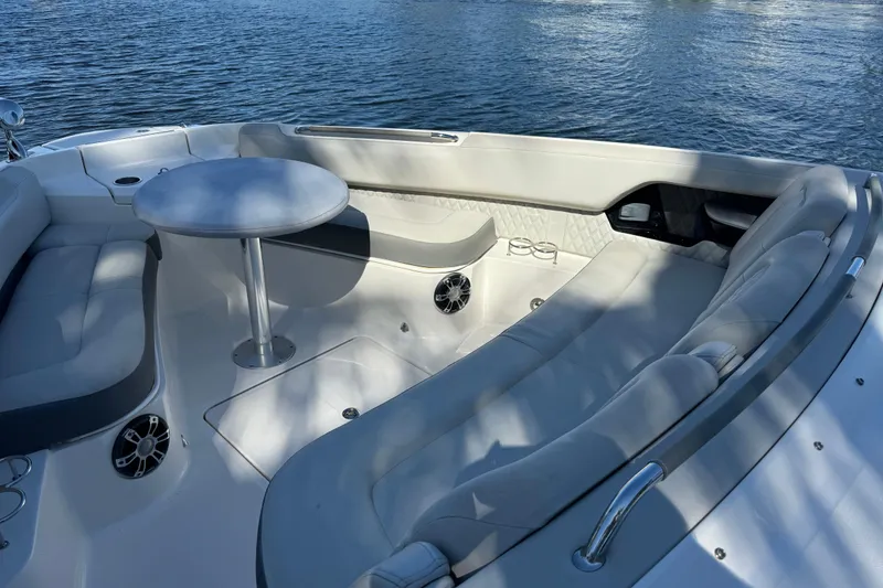 Slide: The Image of Luxurious seating area on 2022 Sea Ray SLX 400 Outboard boat, featuring a round table. - 65