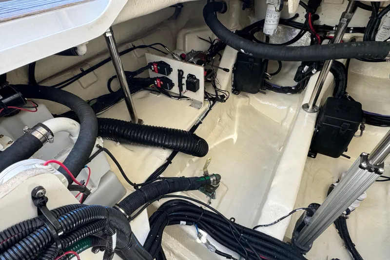Slide: The Image of Engine compartment of 2022 Sea Ray SLX 400 Outboard, showcasing wiring and components. - 67