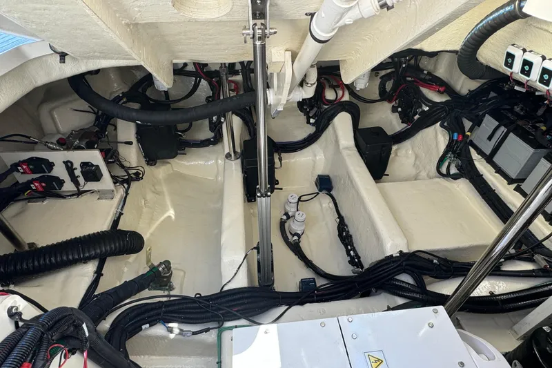 Slide: The Image of Engine compartment of 2022 Sea Ray SLX 400 Outboard, showcasing wiring and components. - 68