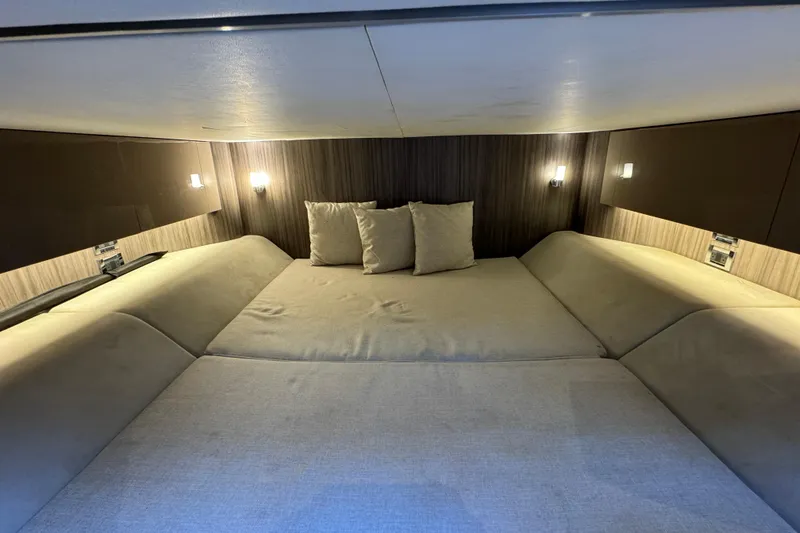 Slide: The Image of Luxurious cabin interior of 2022 Sea Ray SLX 400 Outboard with cozy bedding. - 78