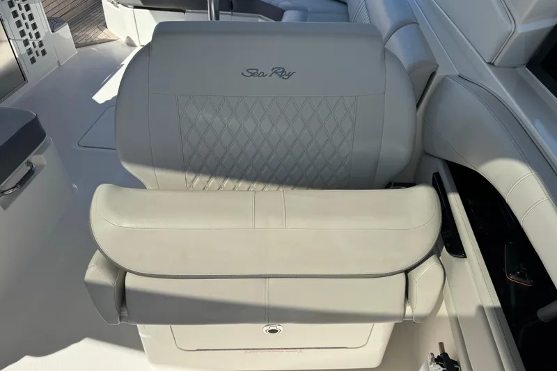 Slide: The Image of 2022 Sea Ray SLX 400 Outboard luxury boat seating with elegant design and stitching. - 9