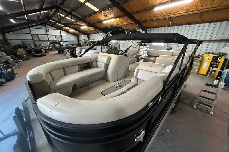 Slide: The Image of 2019 Harris CRUIZER 230 Salt Edition boat, sleek black exterior with silver accents. - 36