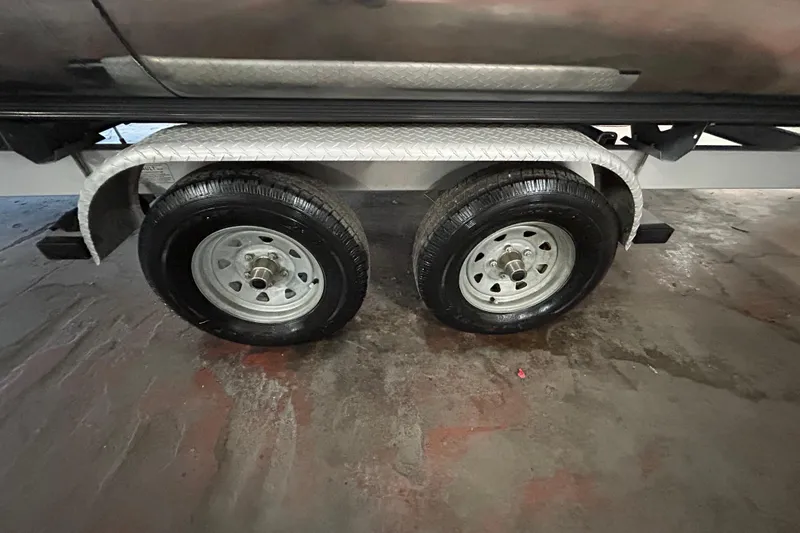 Slide: The Image of Trailer wheels of 2019 Harris CRUIZER 230 SALT EDITION on a wet surface. - 43