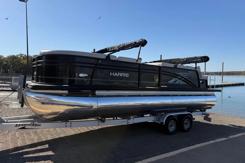 Slide: The Image of 2019 Harris CRUIZER 230 SALT EDITION pontoon boat on trailer by the water. - 46