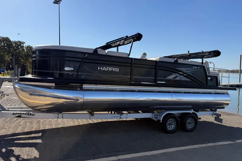 Slide: The Image of 2019 Harris CRUIZER 230 SALT EDITION pontoon boat on trailer by the water. - 47