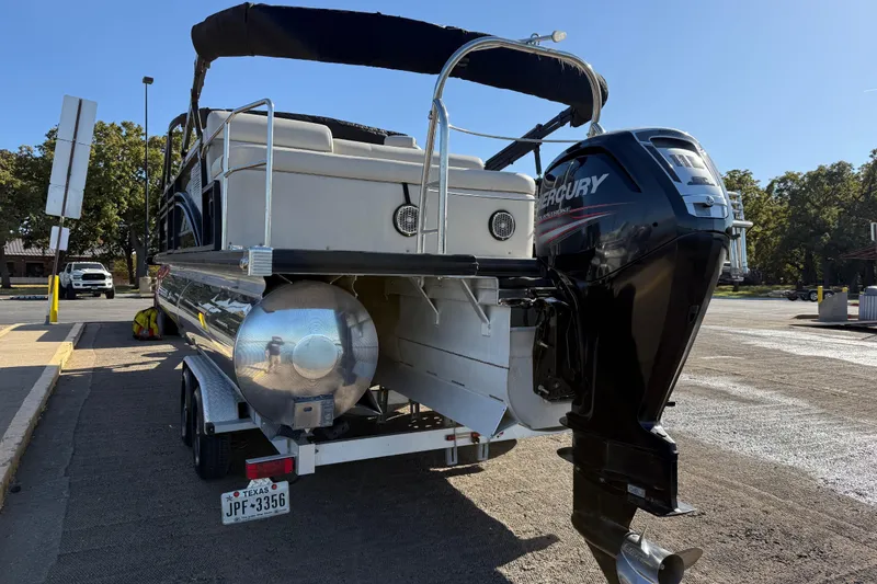 Slide: The Image of 2019 Harris CRUIZER 230 SALT EDITION pontoon boat with Mercury outboard motor on trailer. - 52