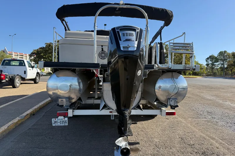 Slide: The Image of 2019 Harris CRUIZER 230 SALT EDITION pontoon boat on trailer, rear view. - 53