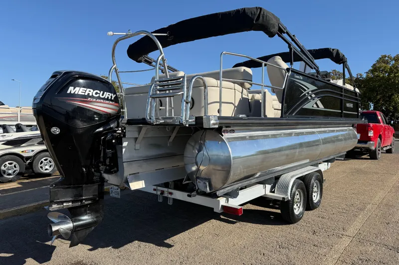 Slide: The Image of 2019 Harris CRUIZER 230 SALT EDITION pontoon boat on trailer with Mercury outboard motor. - 55