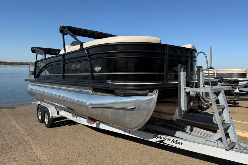 Slide: The Image of 2019 Harris CRUIZER 230 SALT EDITION pontoon boat on trailer by the water. - 63