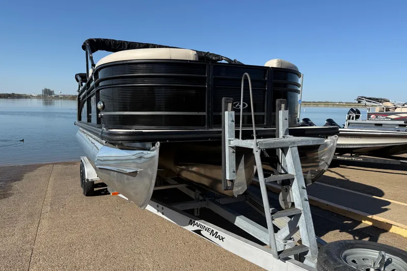 Slide: The Image of 2019 Harris CRUIZER 230 SALT EDITION pontoon boat on trailer by the water. - 64