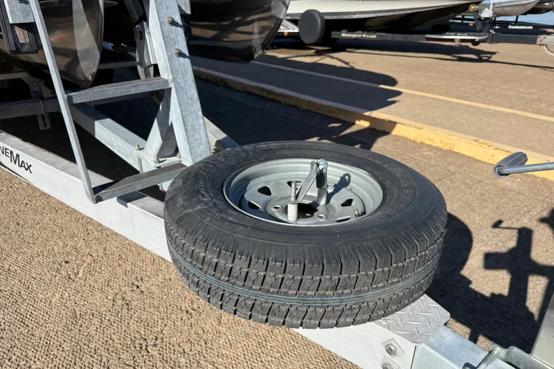 Slide: The Image of Spare tire mounted on a trailer for a 2019 Harris CRUIZER 230 SALT EDITION boat. - 66