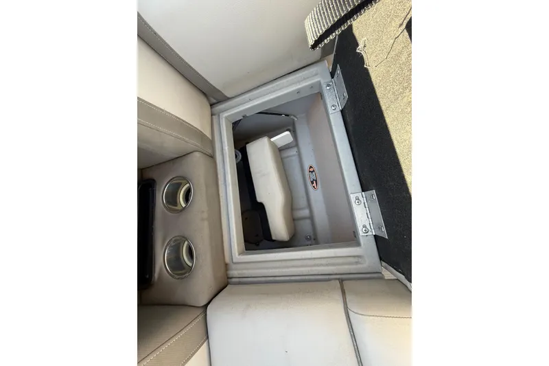 Slide: The Image of 2019 Harris CRUIZER 230 Salt Edition boat storage compartment with cup holders. - 77