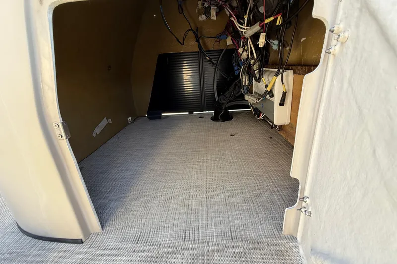 Slide: The Image of Interior view of 2019 Harris CRUIZER 230 SALT EDITION boat compartment with wiring. - 80