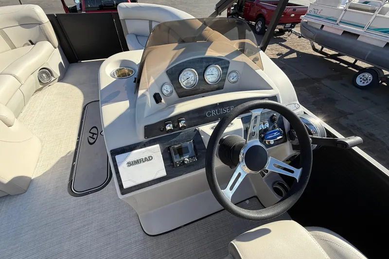 Slide: The Image of 2019 Harris CRUIZER 230 SALT EDITION boat interior with steering wheel and dashboard. - 87