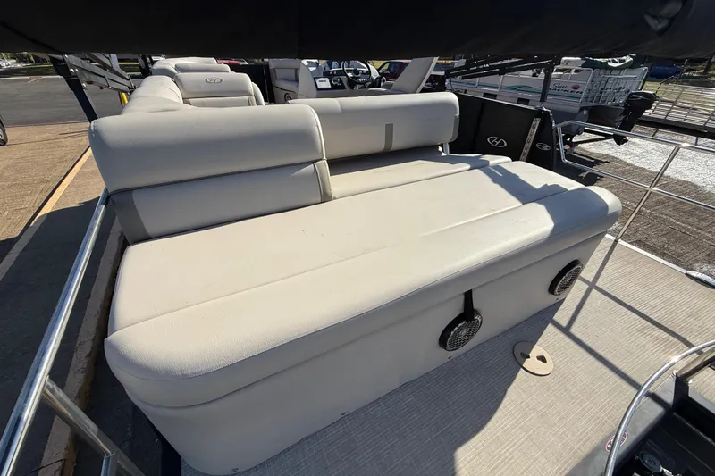 Slide: The Image of 2019 Harris CRUIZER 230 SALT EDITION boat with beige seating and speakers on deck. - 96