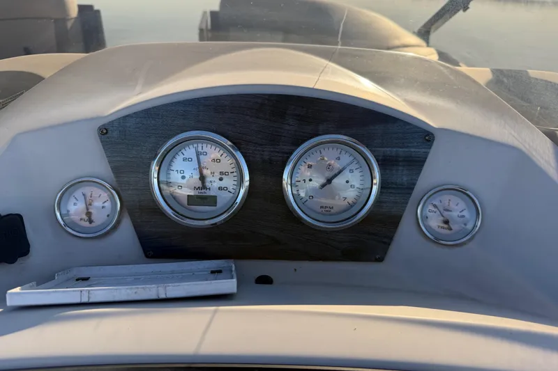 Slide: The Image of Dashboard of 2019 Harris CRUIZER 230 SALT EDITION boat with gauges and controls. - 99