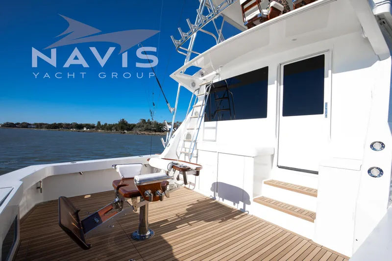 Slide: The Image of Luxurious interior of a 1998 Viking 58 Convertible yacht with modern furnishings and scenic views. - 21