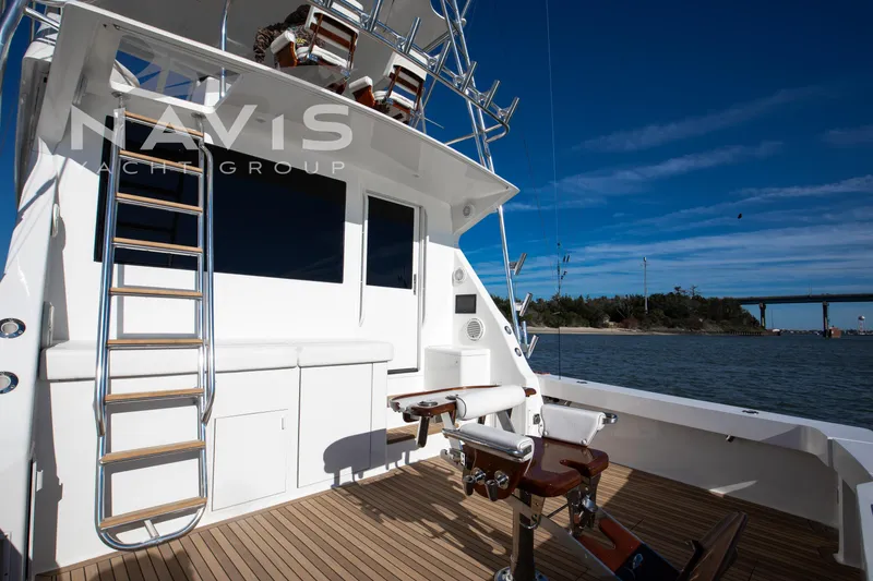 Slide: The Image of Luxurious interior of 1998 Viking 58 Convertible yacht with modern furnishings and scenic views. - 22