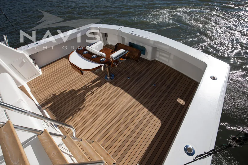 Slide: The Image of Luxurious interior of 1998 Viking 58 Convertible yacht with elegant seating and scenic water views. - 23