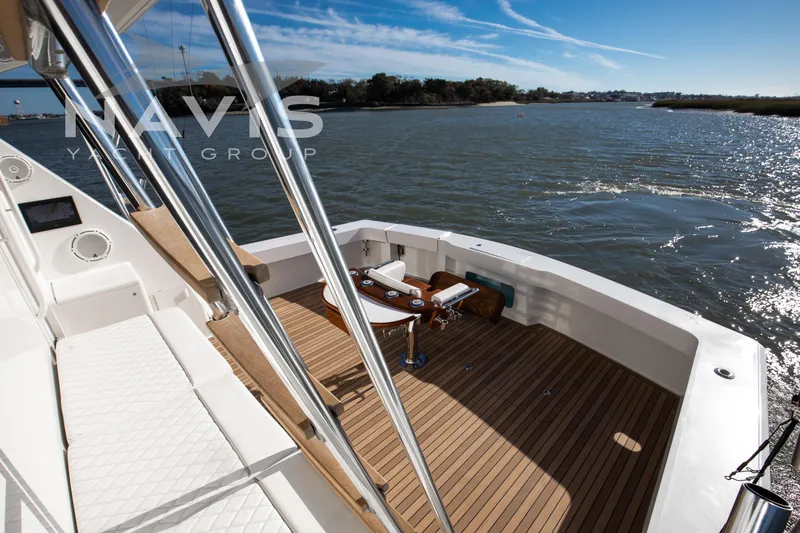 Slide: The Image of Luxurious interior of 1998 Viking 58 Convertible yacht with scenic water view. - 24