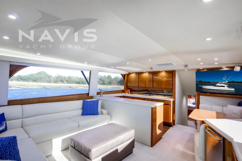 Slide: The Image of Luxurious interior of 1998 Viking 58 Convertible yacht with elegant seating and modern amenities. - 26