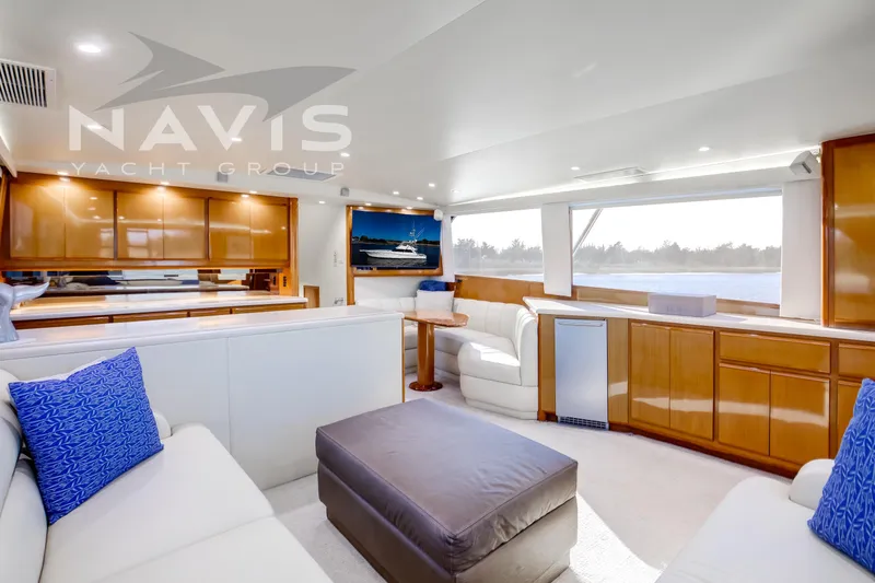 Slide: The Image of Interior view of 1998 Viking 58 Convertible yacht with scenic waterway backdrop. - 31