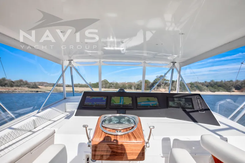 Slide: The Image of Luxurious 1998 Viking 58 Convertible yacht interior with scenic water view. - 33