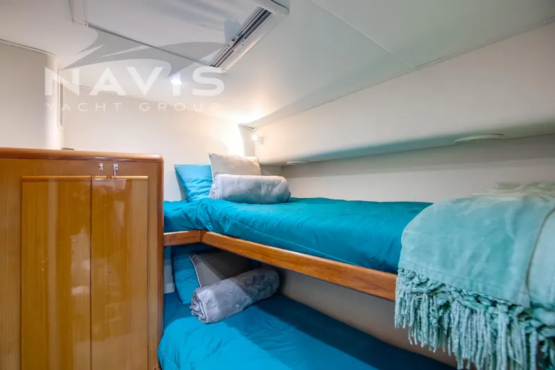Slide: The Image of Bathroom interior of 1998 Viking 58 Convertible yacht with blue towels and modern fixtures. - 47