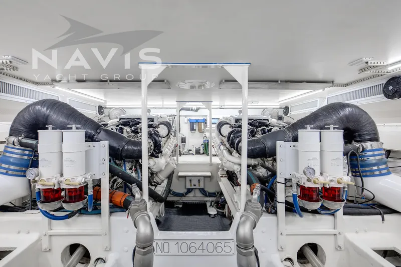 Slide: The Image of Engine room of 1998 Viking 58 Convertible yacht, showcasing dual engines and mechanical systems. - 49
