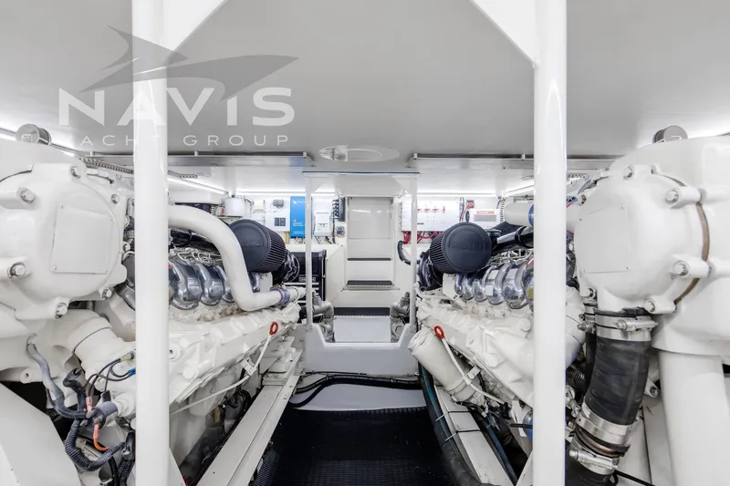 Slide: The Image of Engine room of 1998 Viking 58 Convertible yacht, showcasing machinery and equipment. - 50
