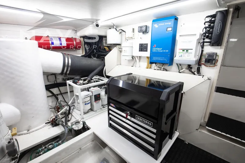 Slide: The Image of Engine room of 1998 Viking 58 Convertible yacht with equipment and tool storage. - 55